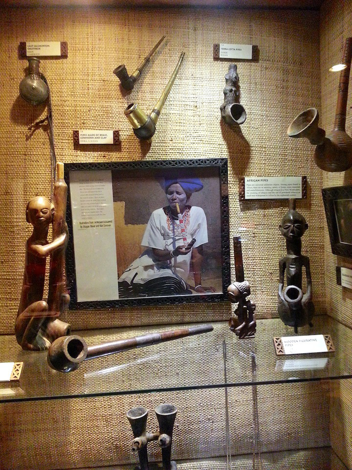 A Kenyan woman smoking a long stemmed pipe that I saw during my Nairobi, Kenya travelogue.