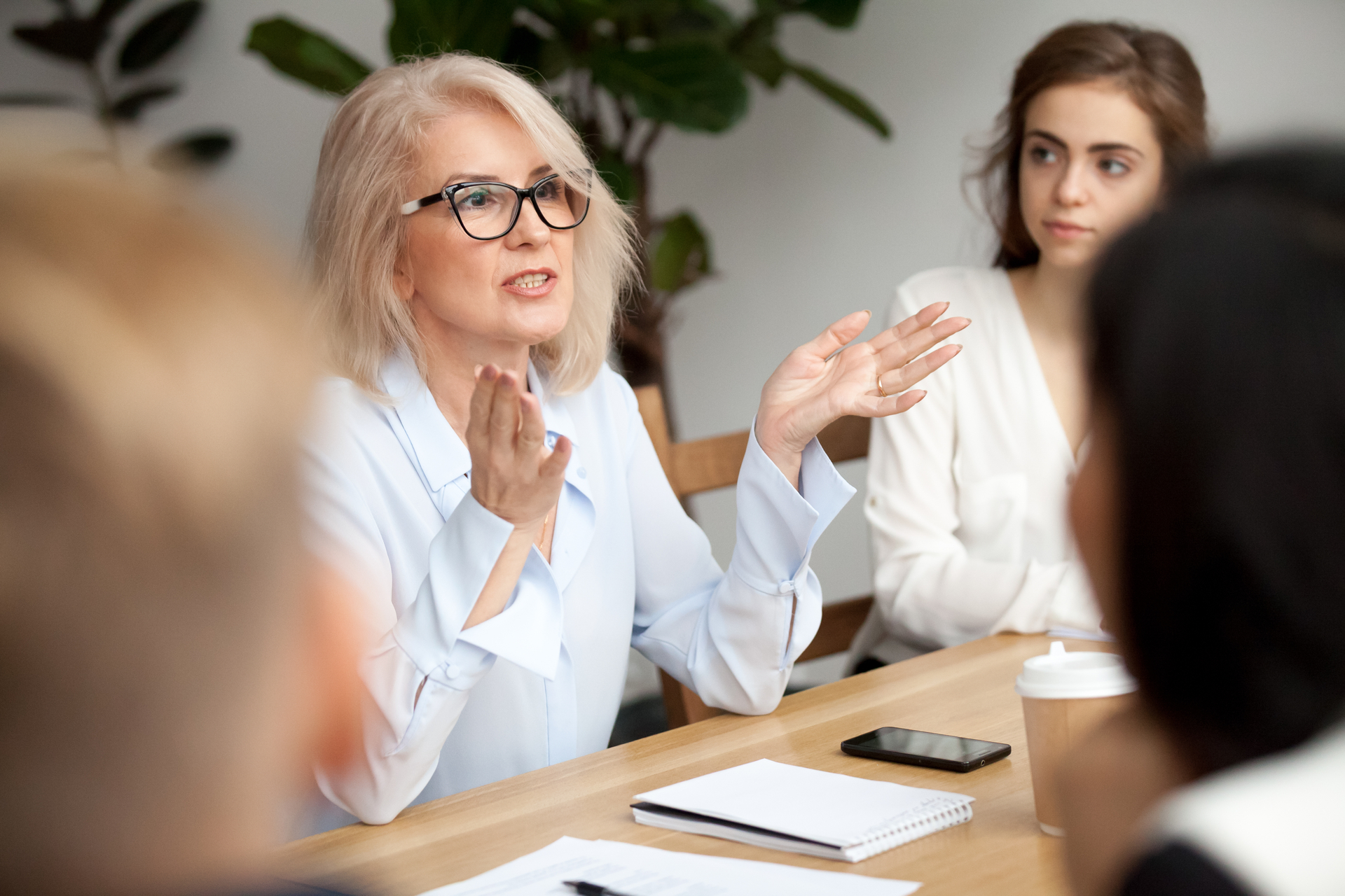 This white female trainer is conducting an evaluation with her students.